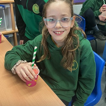 girl sitting and holding a smoothie