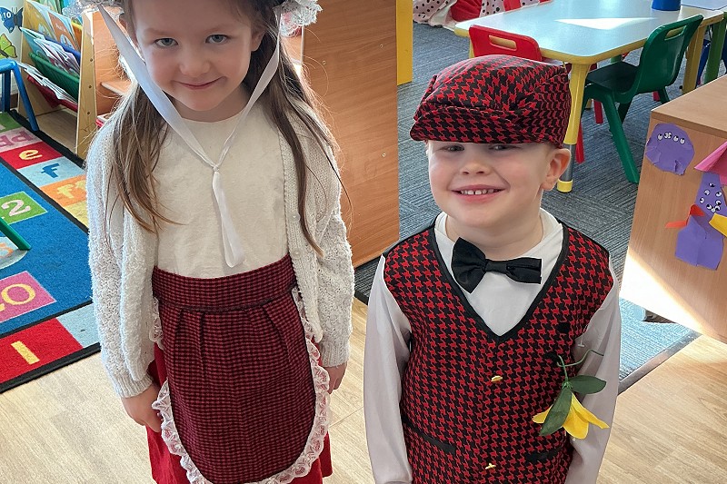 Boy and girl in traditional Welsh clothes for St David's Day