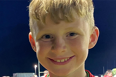 rugby player holding a thumbs up