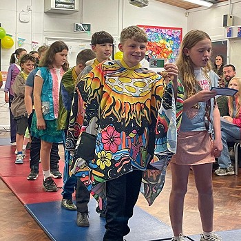 Year 6 children enjoying the fashion show