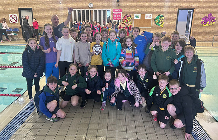 Ysgol y Gelli swimming team celebrating their success in the school swimming competition